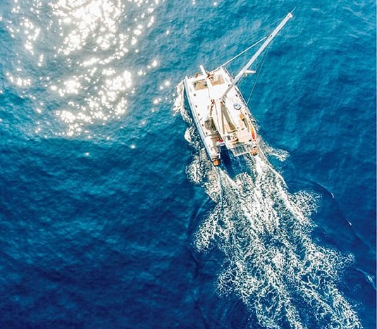 Luxury yacht sailing in deep blue ocean near Delft Island, Jaffna, Sri Lanka – adventure and boat tour experience