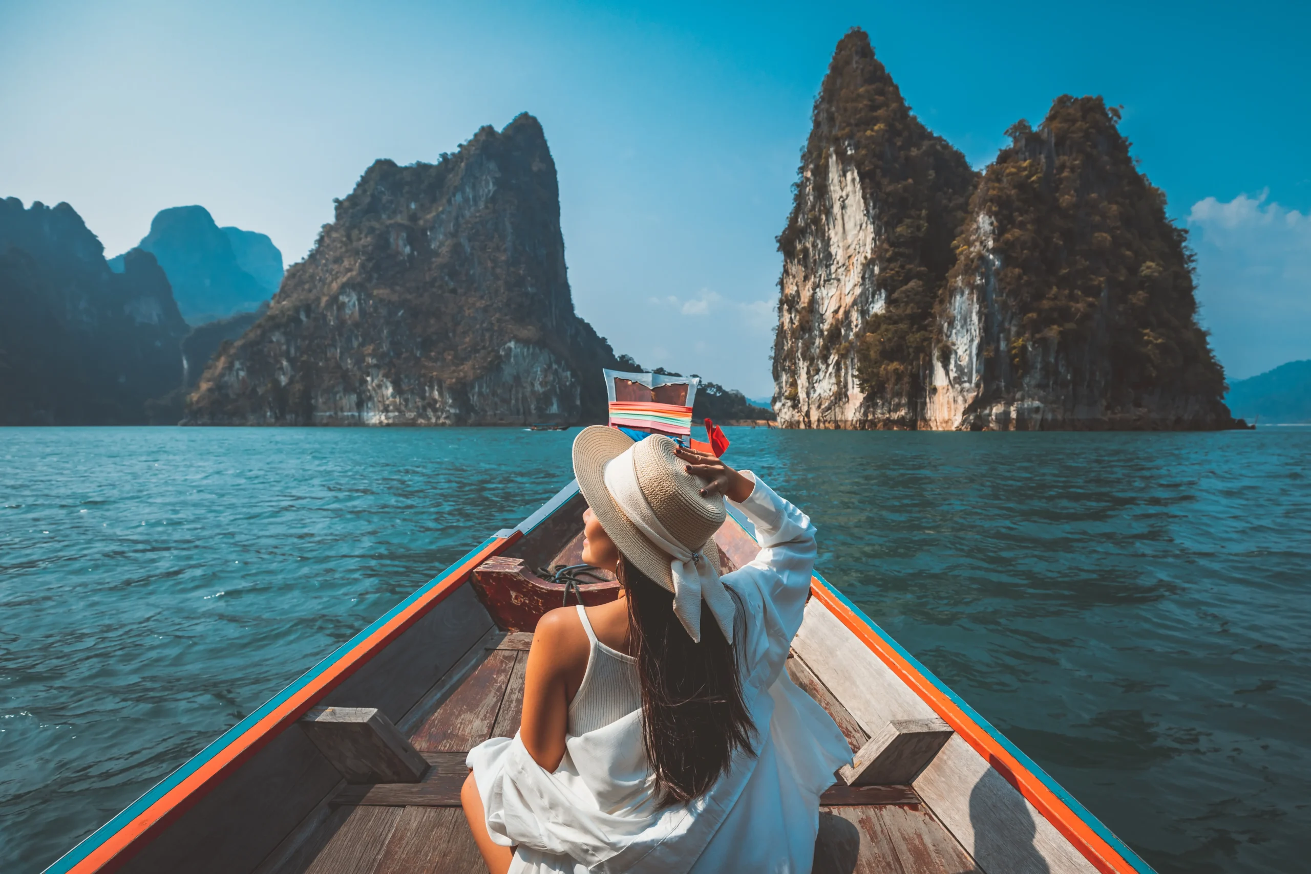 Eswar Tours Thailand tour package with island boat trip, tropical summer vacation destination with limestone cliffs and blue sea